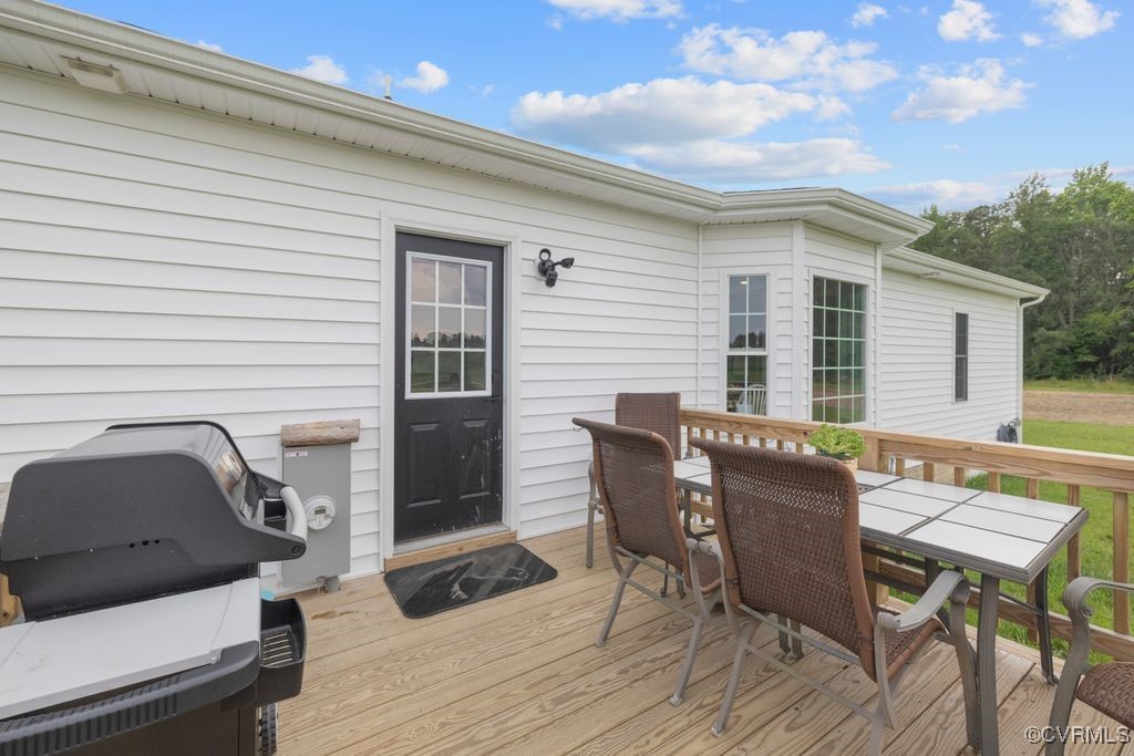 9530 Dabneys Mill Road Manquin, VA 23106 - Photo 22 of 40 Wooden deck with outdoor dining area and grilling