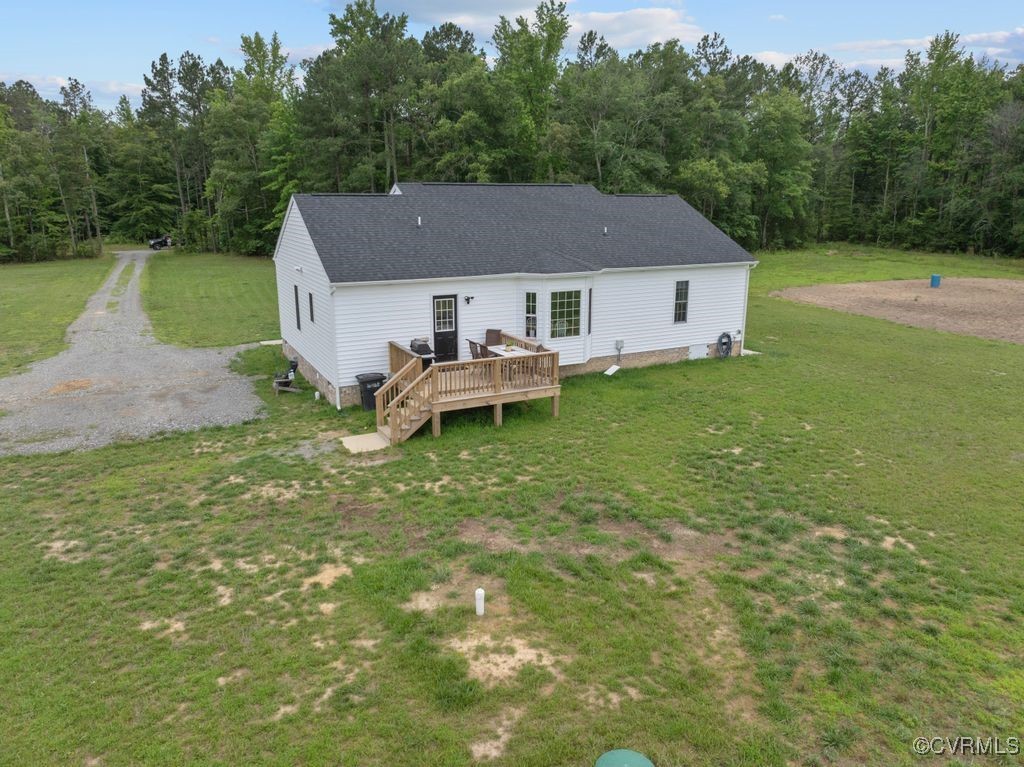 9530 Dabneys Mill Road Manquin, VA 23106 - Photo 35 of 40 Rear view of house with a wooden deck, a lawn, roo