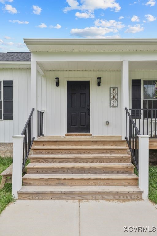 9530 Dabneys Mill Road Manquin, VA 23106 - Photo 5 of 40 Property entrance with a porch, a shingled roof, a