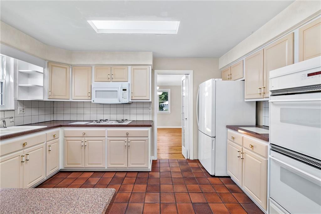 199 Farmington Road Pittsburgh, PA 15215 - Photo 11 of 46 a kitchen with a white stove top oven and refrigerator