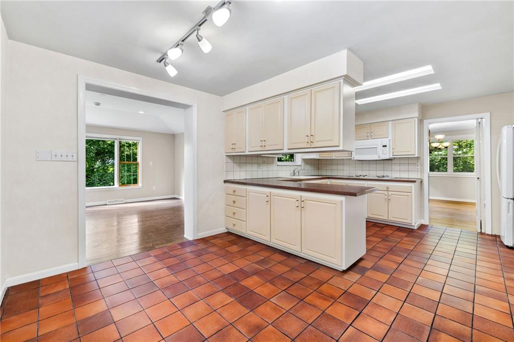 199 Farmington Road Pittsburgh, PA 15215 - Photo 13 of 46 a kitchen with stainless steel appliances granite countertop a sink and cabinets