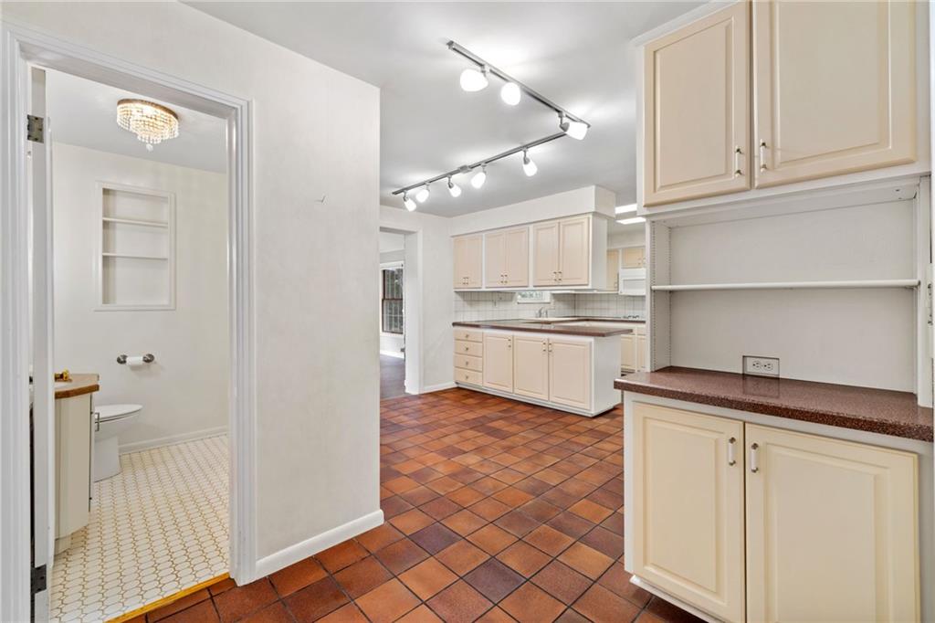 199 Farmington Road Pittsburgh, PA 15215 - Photo 14 of 46 a kitchen with white cabinets and sink