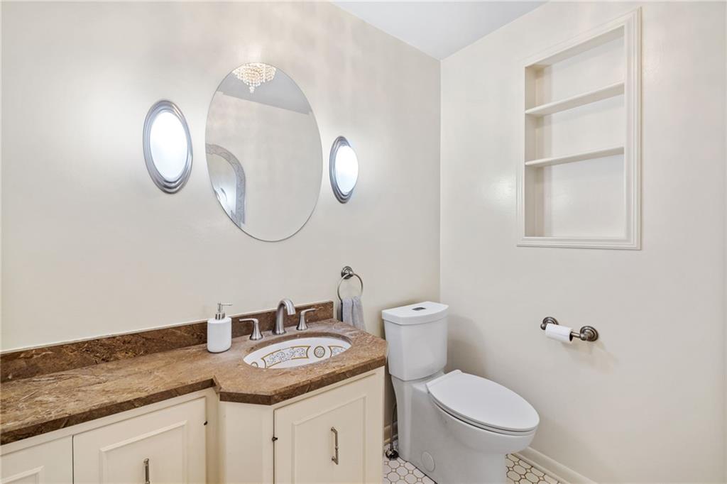 199 Farmington Road Pittsburgh, PA 15215 - Photo 15 of 46 a bathroom with a granite countertop toilet sink and mirror