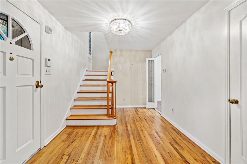 199 Farmington Road Pittsburgh, PA 15215 - Photo 2 of 46 a view of a hallway with wooden floor and staircase