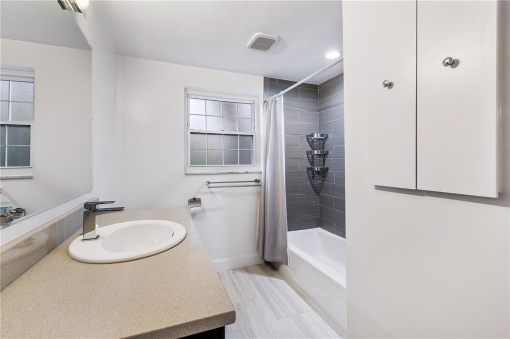 199 Farmington Road Pittsburgh, PA 15215 - Photo 28 of 46 a bathroom with a sink and mirror