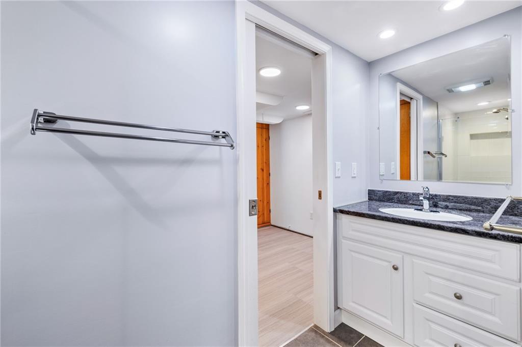 199 Farmington Road Pittsburgh, PA 15215 - Photo 35 of 46 a bathroom with a granite countertop sink and a mirror