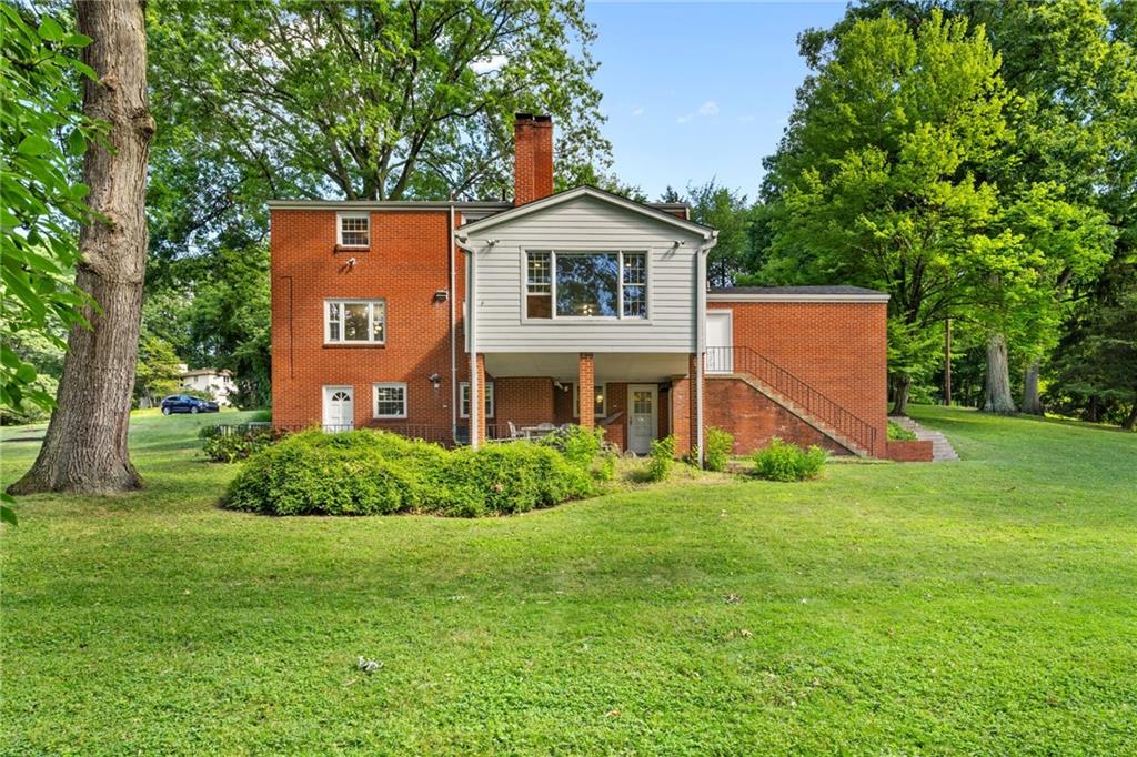 199 Farmington Road Pittsburgh, PA 15215 - Photo 40 of 46 a view of a house with a big yard and large trees