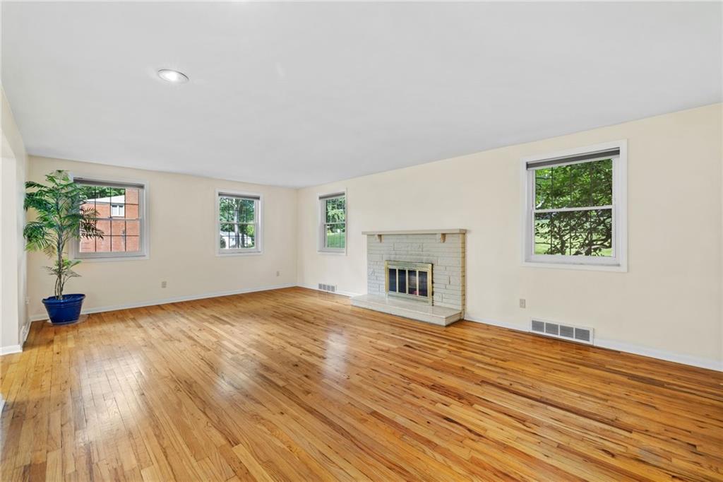 199 Farmington Road Pittsburgh, PA 15215 - Photo 4 of 46 a view of empty room with wooden floor and fan