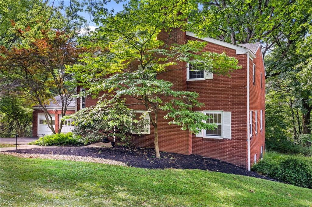 199 Farmington Road Pittsburgh, PA 15215 - Photo 42 of 46 a view of a house with a yard and potted plants
