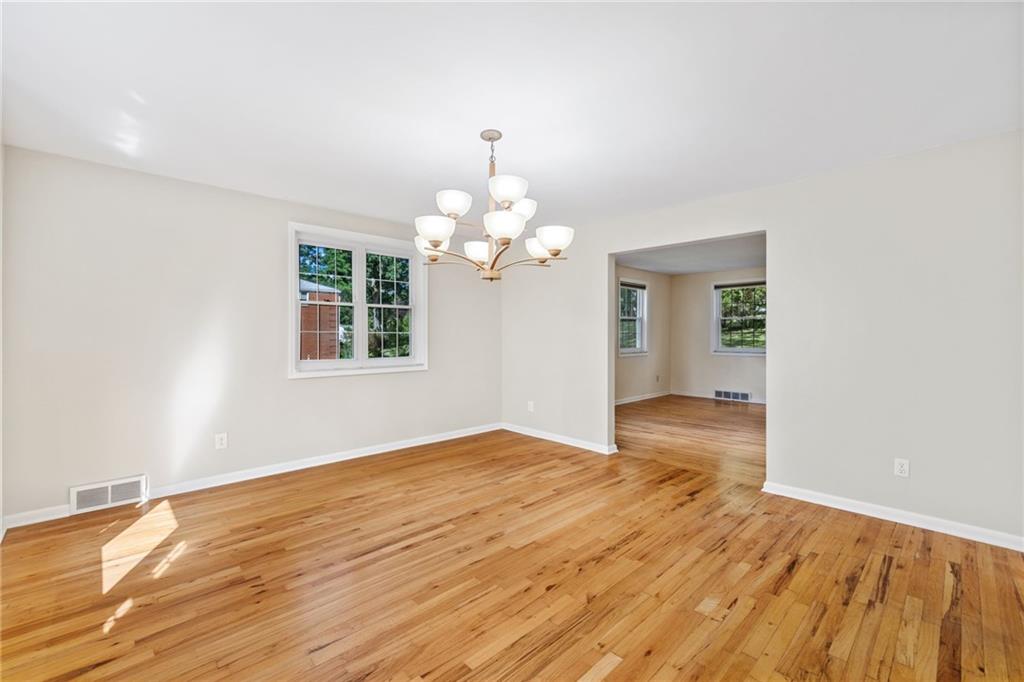 199 Farmington Road Pittsburgh, PA 15215 - Photo 8 of 46 a view of an empty room with wooden floor and a window