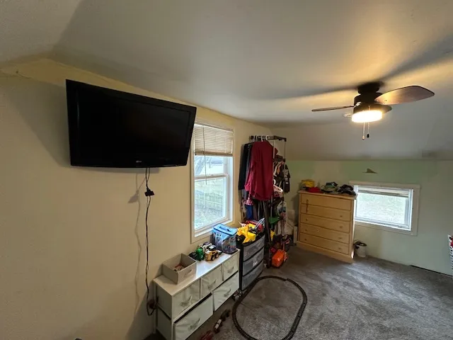 a room with furniture and a flat screen tv