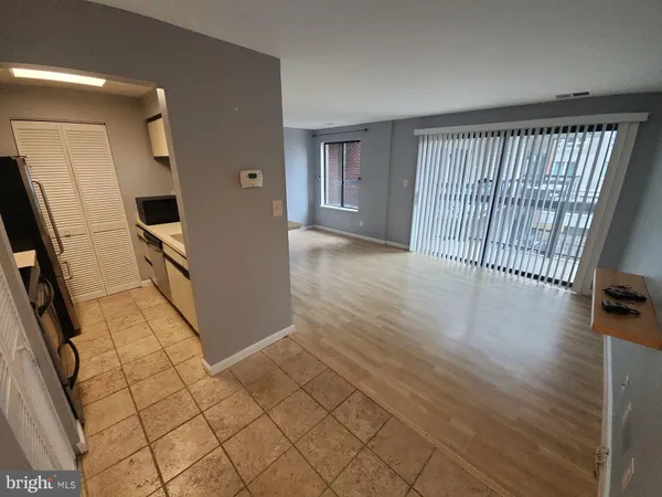 a view of an empty room and window