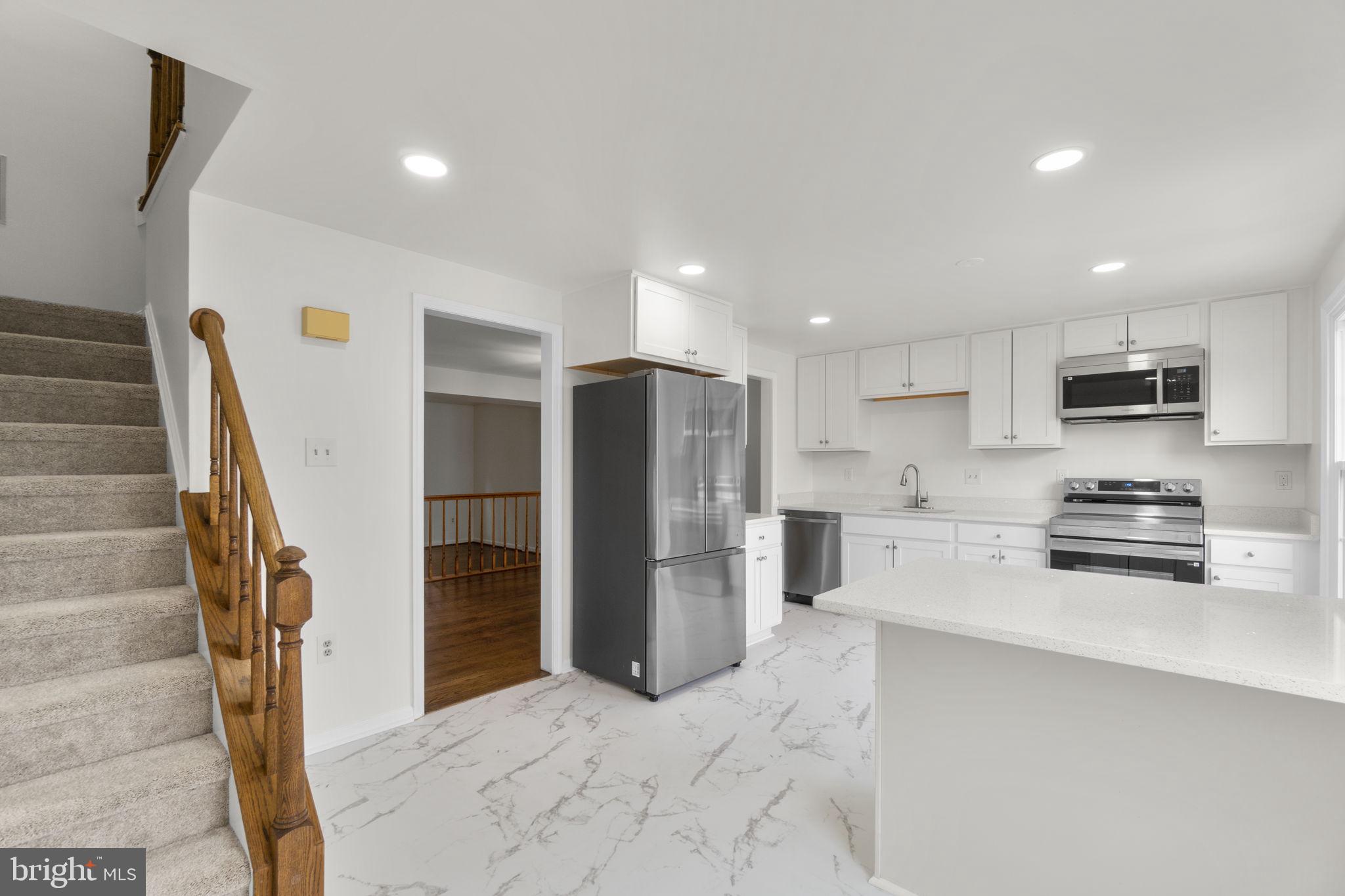 8039 Hollow Reed Court Frederick, MD 21701 - Photo 5 of 28 Modern kitchen with sleek finishes.