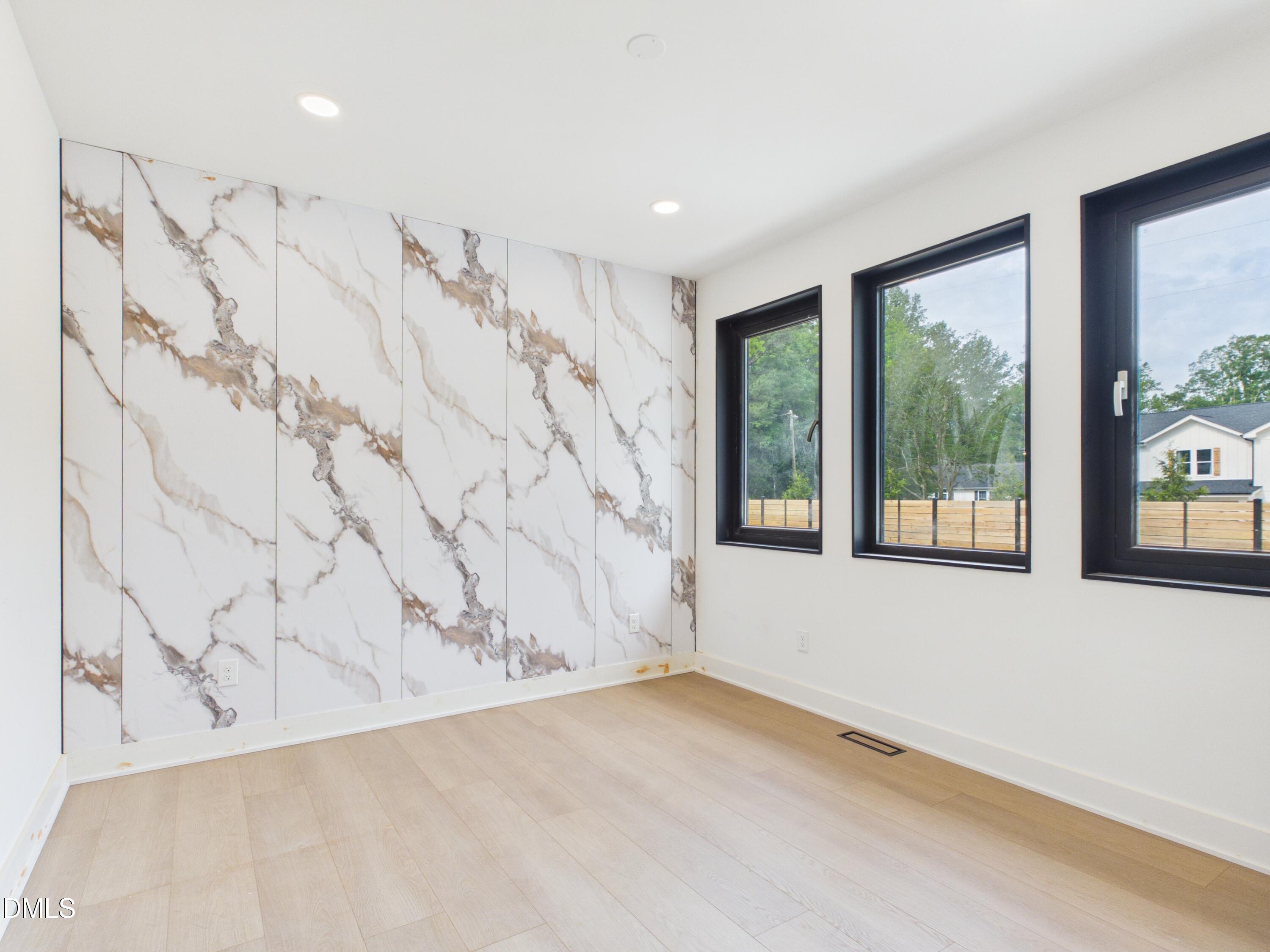 6925 Buckhorn-Duncan Road Holly Springs, NC 27540 - Photo 13 of 43 a view of a room with a large window