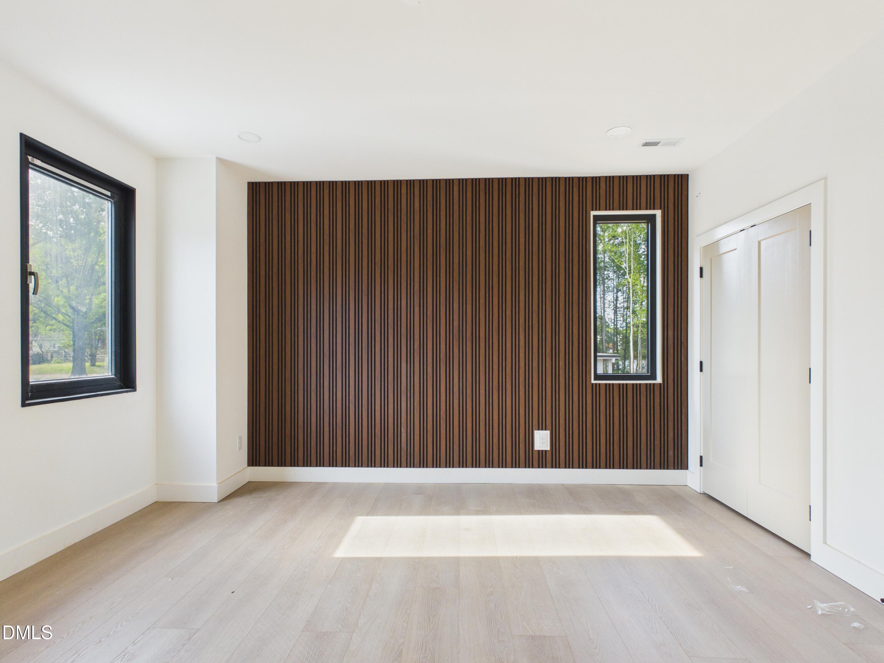 6925 Buckhorn-Duncan Road Holly Springs, NC 27540 - Photo 24 of 43 an empty room with windows