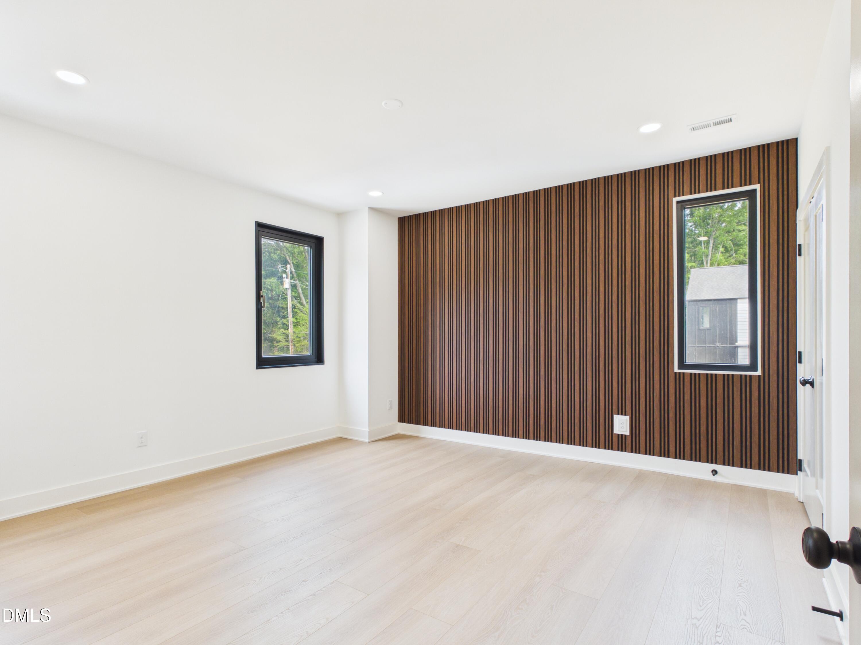 6925 Buckhorn-Duncan Road Holly Springs, NC 27540 - Photo 25 of 43 an empty room with windows