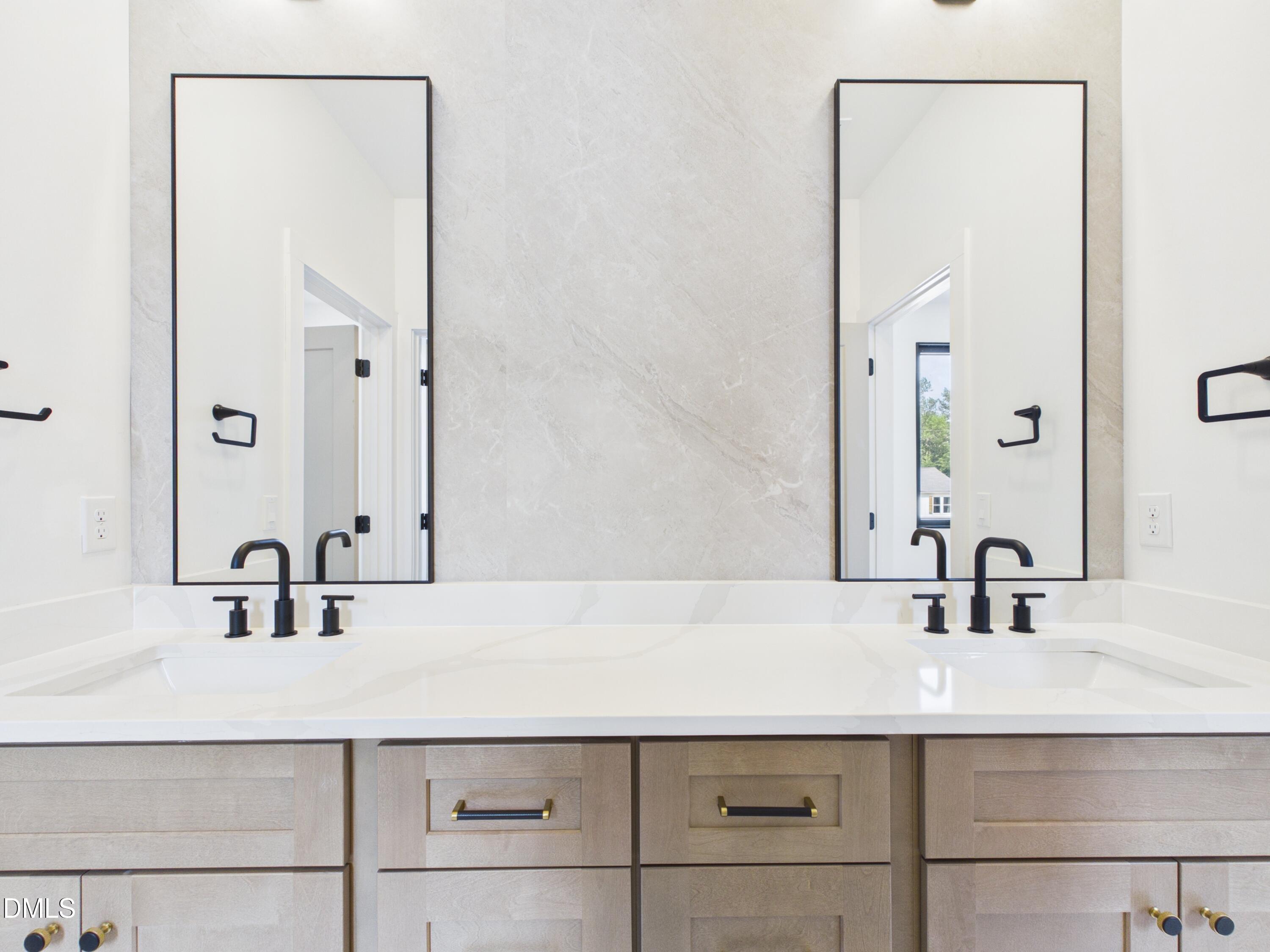 6925 Buckhorn-Duncan Road Holly Springs, NC 27540 - Photo 28 of 43 a bathroom with a sink and a mirror