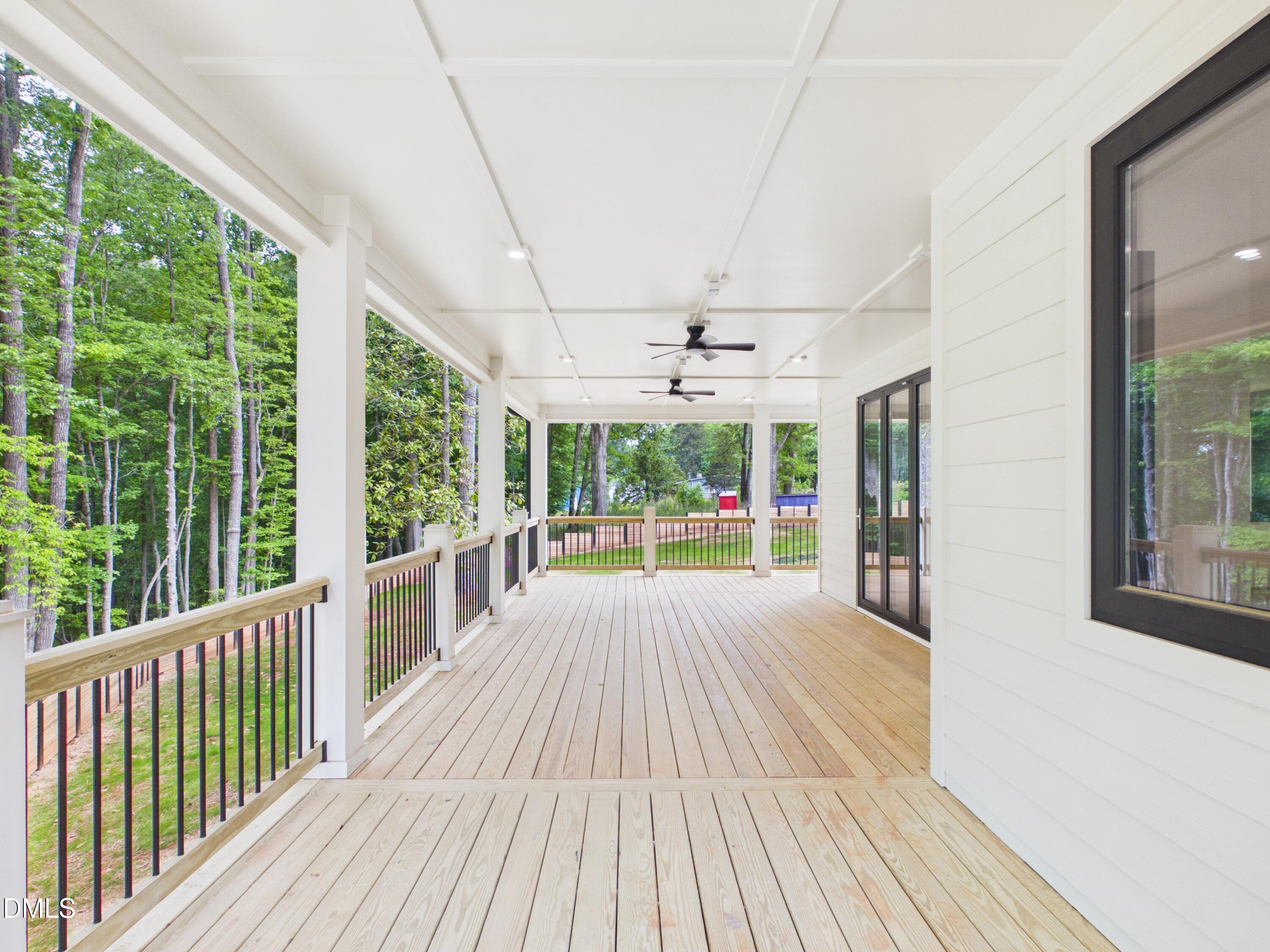 6925 Buckhorn-Duncan Road Holly Springs, NC 27540 - Photo 35 of 43 a view of a patio with wooden floor