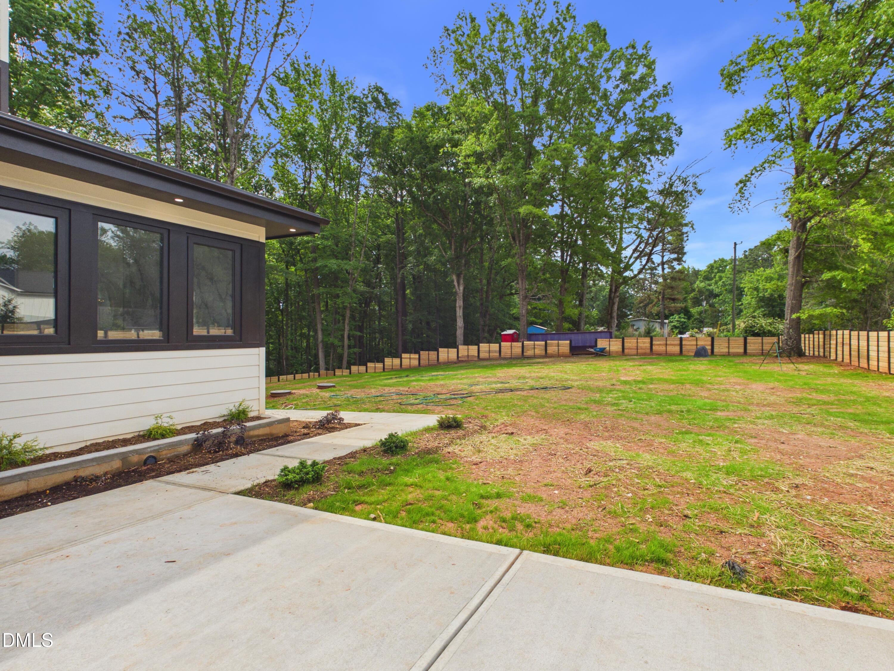 6925 Buckhorn-Duncan Road Holly Springs, NC 27540 - Photo 37 of 43 a front view of a house with a yard