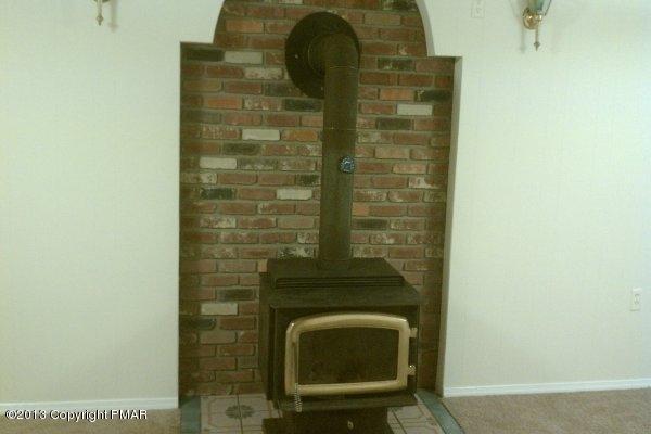 85 Huffman Circle Bushkill, PA 18324 - Photo 7 of 20 Wood Stove with Brick