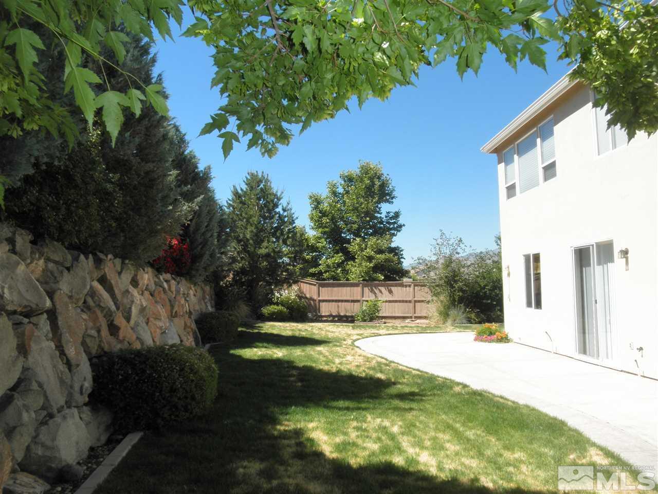 10550 Autumn Walk Court Reno, NV 89521 - Photo 13 of 15 a view of swimming pool with a yard