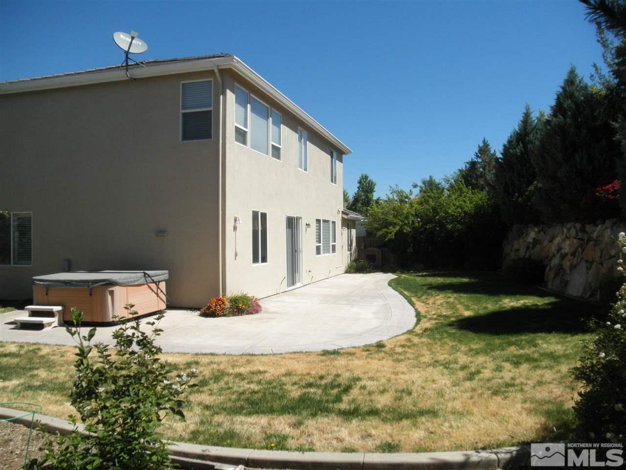 10550 Autumn Walk Court Reno, NV 89521 - Photo 14 of 15 a backyard of a house with yard barbeque oven and outdoor seating