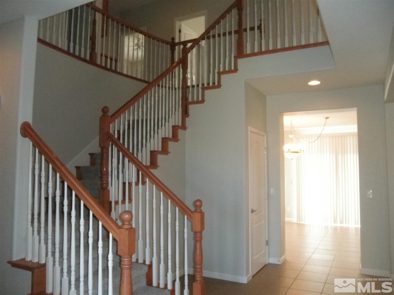 10550 Autumn Walk Court Reno, NV 89521 - Photo 2 of 15 a view of staircase with railing and white walls
