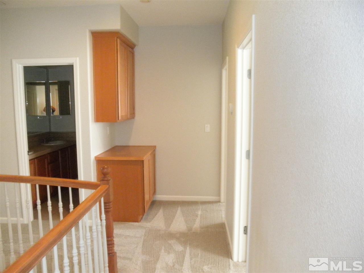 10550 Autumn Walk Court Reno, NV 89521 - Photo 9 of 15 a view of an entryway with wooden floor and door