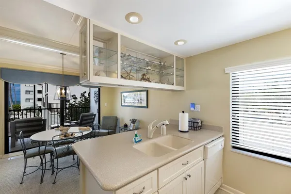 a kitchen with a dining table and chairs