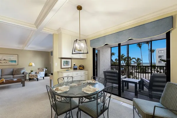a view of a dining room with furniture window and outside view