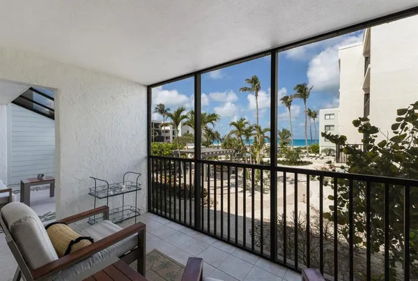 a view of a porch with furniture