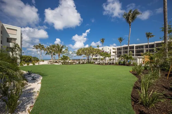 a view of a patio with dining table and chairs