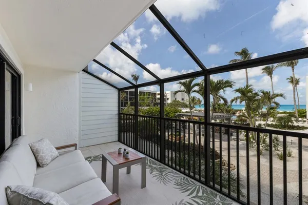 a view of a porch with furniture and outside view