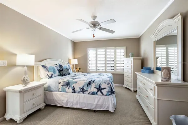 a bedroom with bed and window