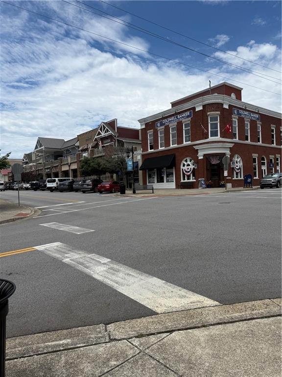 35 Mountain Road Morganton, GA 30560 - Photo 14 of 26 a front view of a building with lot of cars and trees