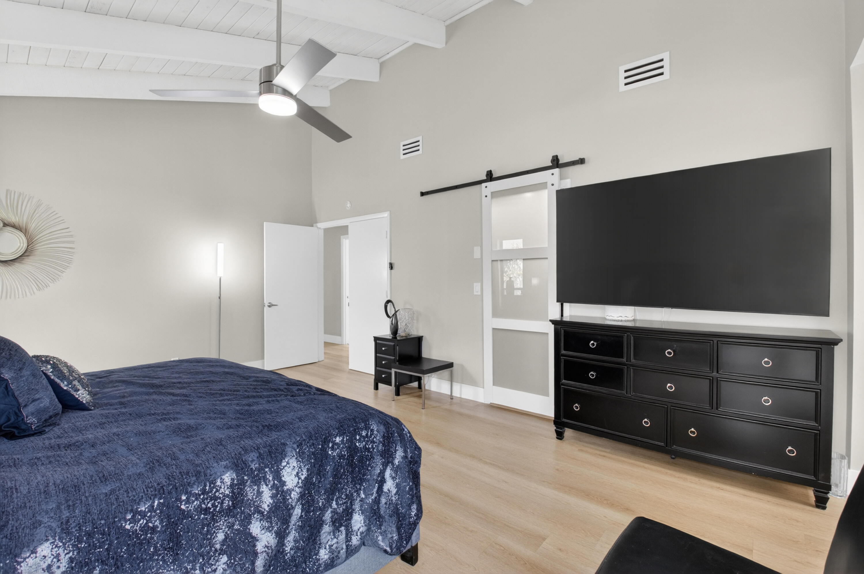 7374 Woodmont Court Boca Raton, FL 33434 - Photo 27 of 95 a bedroom with a bed and a flat screen tv