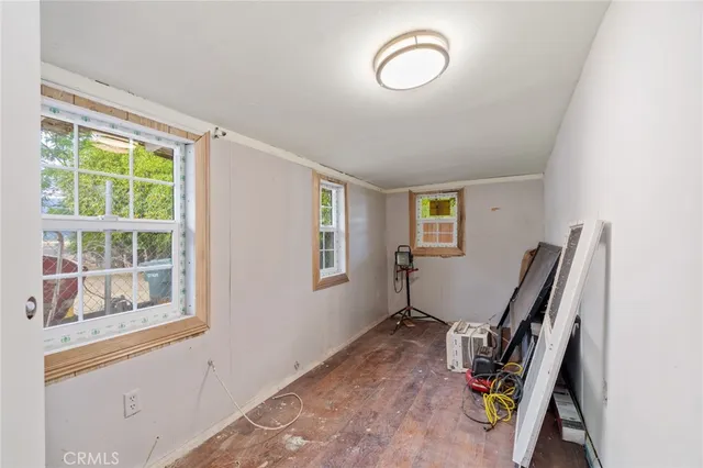 a view of a livingroom with furniture and a window