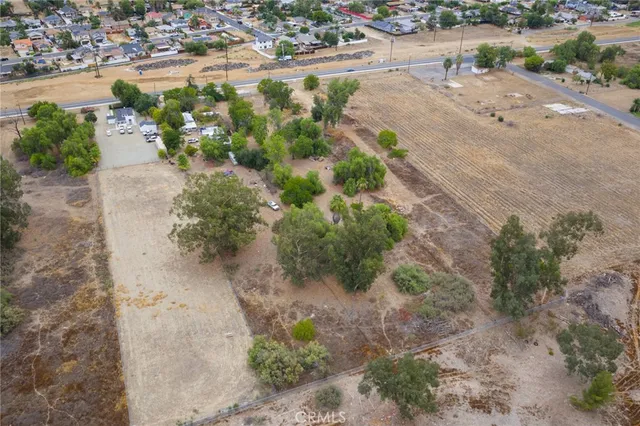 an aerial view of a houses with a yard