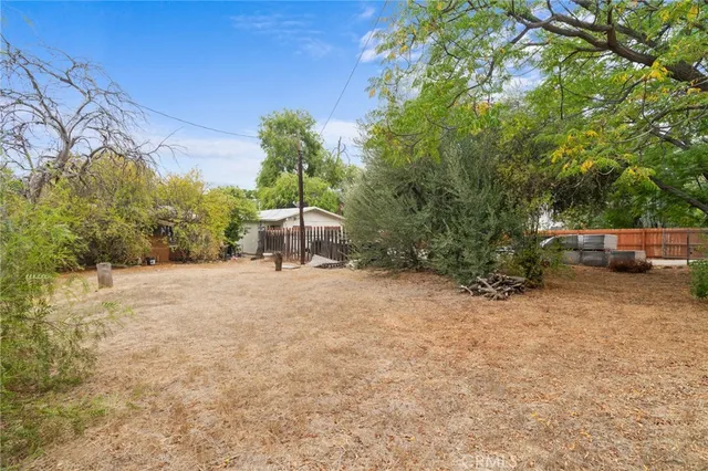 a backyard of a house with lots of green space