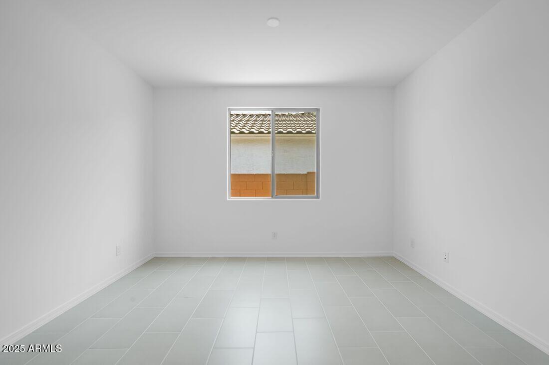 14323 West Alameda Road Surprise, AZ 85387 - Photo 12 of 56 an empty room with a window