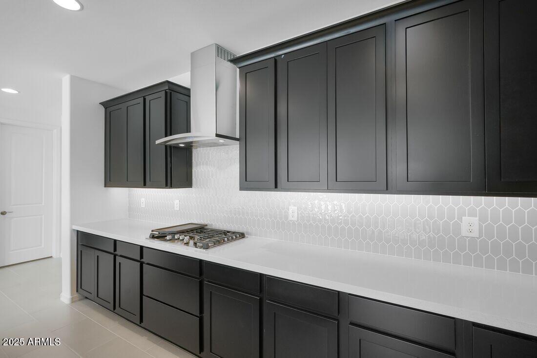 14323 West Alameda Road Surprise, AZ 85387 - Photo 19 of 56 a kitchen with cabinets and stainless steel appliances