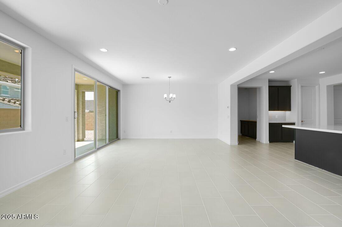 14323 West Alameda Road Surprise, AZ 85387 - Photo 24 of 56 a view of an empty room with a window