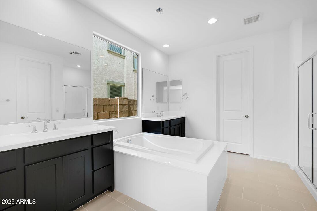 14323 West Alameda Road Surprise, AZ 85387 - Photo 28 of 56 a bathroom with a sink double vanity granite and a mirror