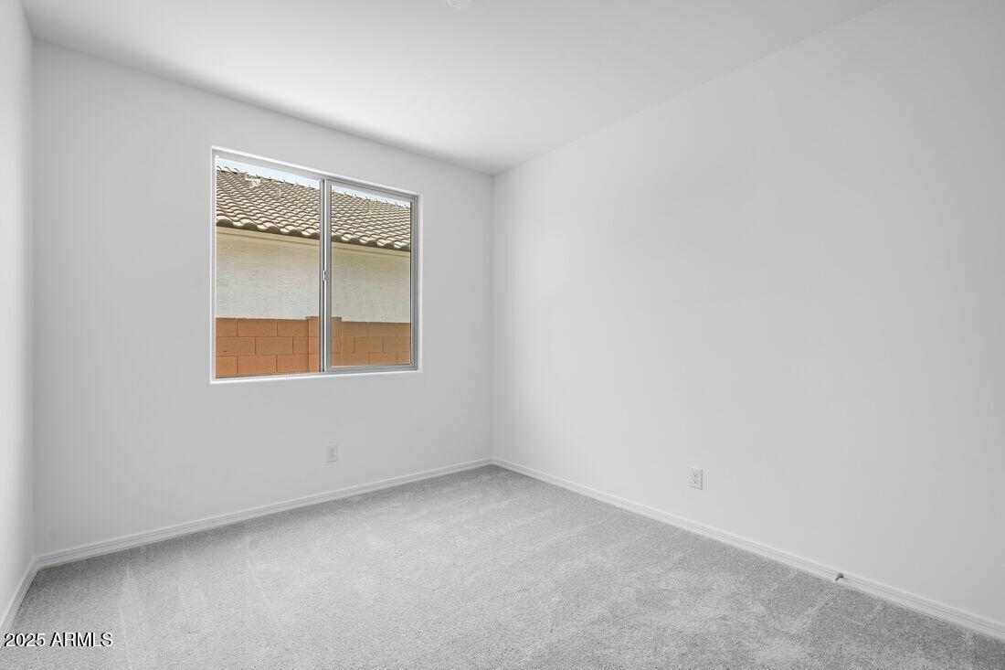 14323 West Alameda Road Surprise, AZ 85387 - Photo 30 of 56 an empty room with a window