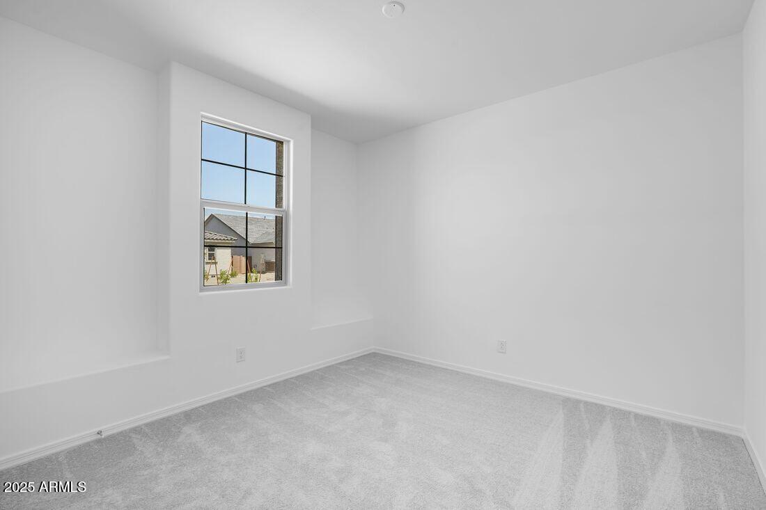 14323 West Alameda Road Surprise, AZ 85387 - Photo 32 of 56 an empty room with windows