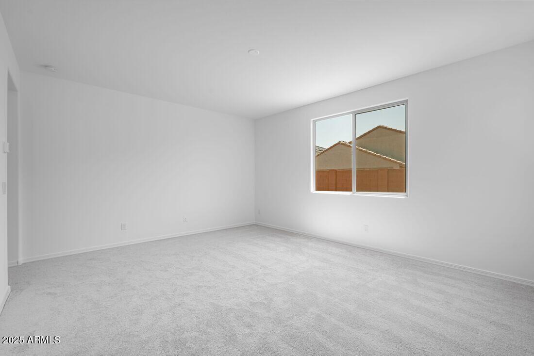 14323 West Alameda Road Surprise, AZ 85387 - Photo 39 of 56 an empty room with windows