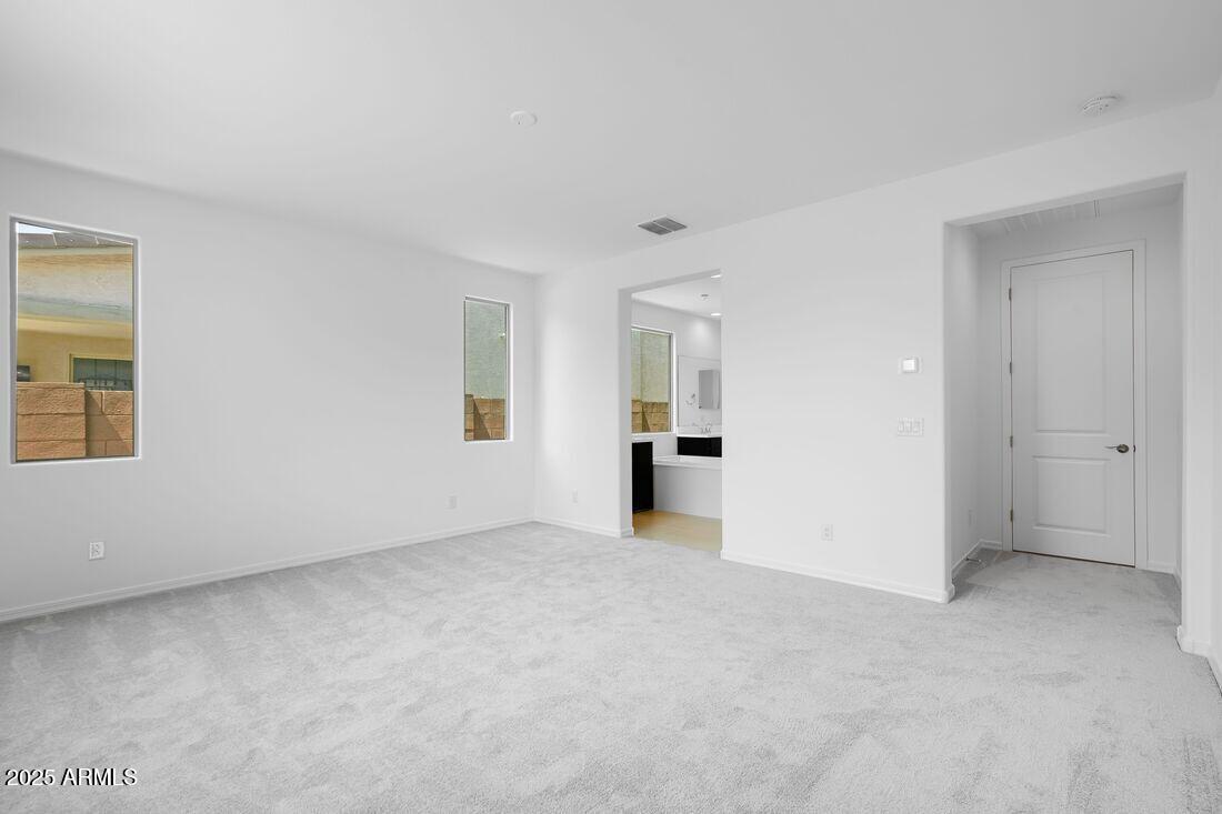 14323 West Alameda Road Surprise, AZ 85387 - Photo 40 of 56 a view of an empty room with a window