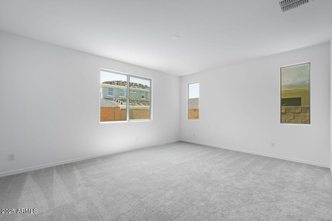 14323 West Alameda Road Surprise, AZ 85387 - Photo 41 of 56 an empty room with windows