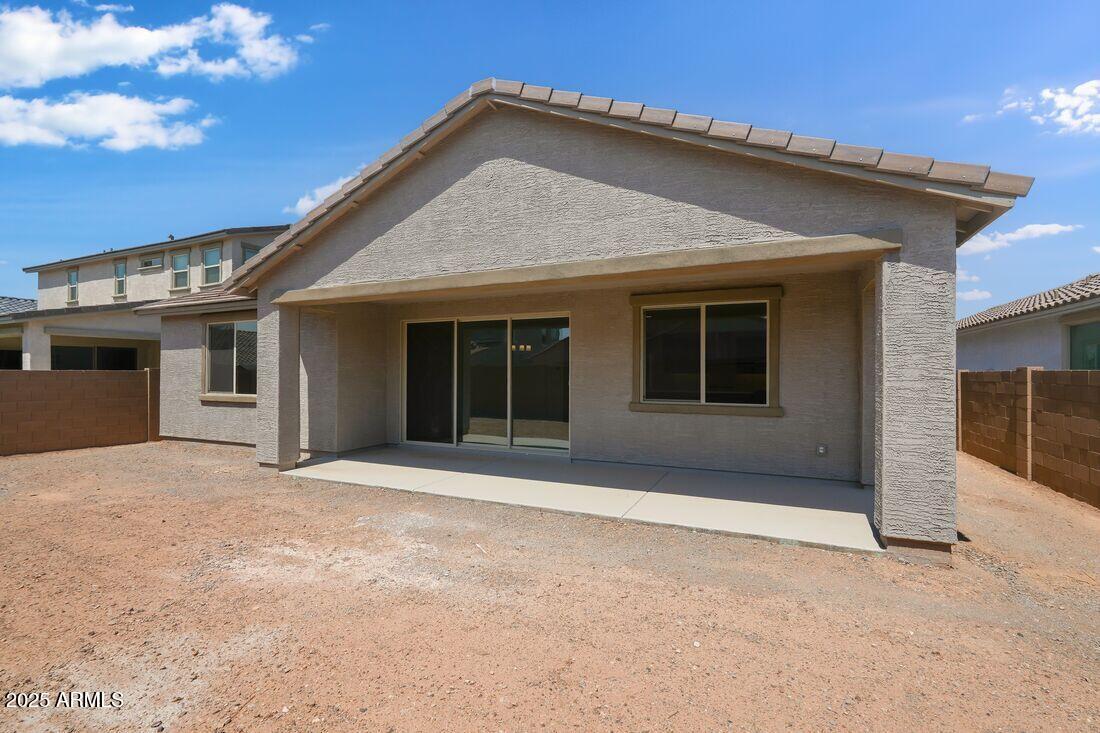 14323 West Alameda Road Surprise, AZ 85387 - Photo 44 of 56 a front view of a house with a plants and trees