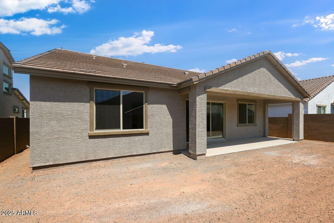 14323 West Alameda Road Surprise, AZ 85387 - Photo 45 of 56 a front view of a house with a garden